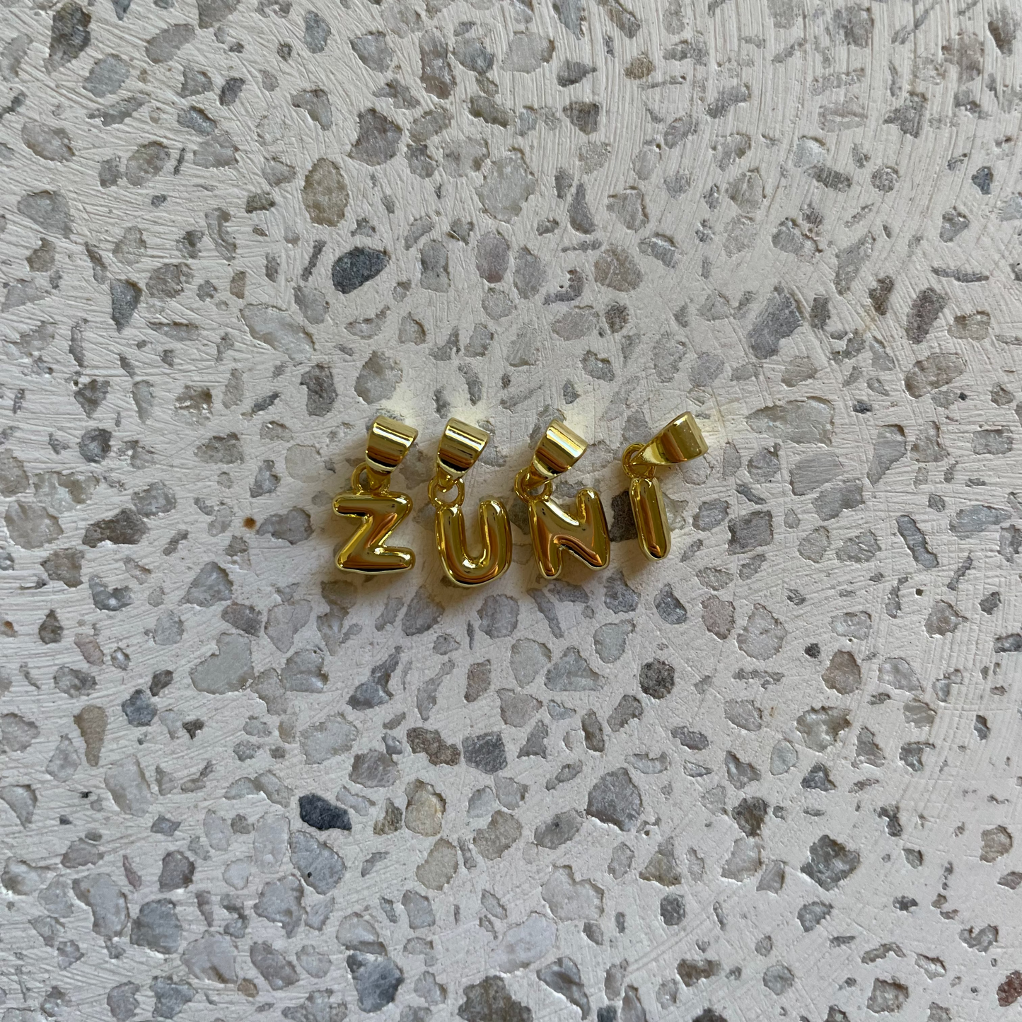 INITIAL CHARM